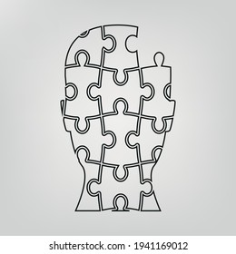 Ilustración vectorial de la cabeza humana hecha de piezas de rompecabezas