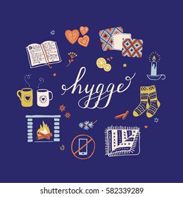 Vector illustration with Hygge lettering and cozy home things like candles, socks, oversize rug, tea, fireplace. Danish living concept. Greeting card template, hand drawn style.