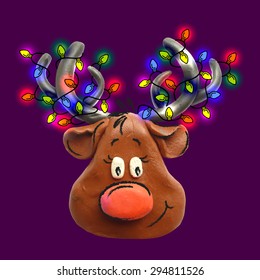 Vector illustration. Icon of plasticine Reindeer Rudolph and Garland