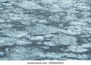 Ilustración vectorial de una superficie de un río helado. Textura de fragmentos de hielo y agua. Fondo de invierno.

