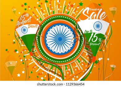 Vector Illustration for "India Independence Day" Sale Promotion with two kites for promotion text in front of an abstract circular and fireworks with a blue wheel and the tricolor of Indian Flag