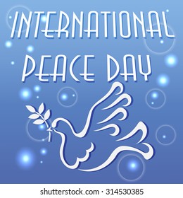 Vector illustration for the international day of peace with a dove and olive branch on blue background