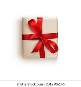 ilustración vectorial de regalo aislado, caja en embalaje de vacaciones con arco rojo.Elemento de diseño para una postal o cartel de saludo en un fondo blanco.Estilo realista.Presente con cinta.Vista superior.Plana capa
