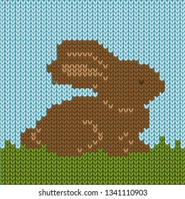 Vector illustration of knitted Easter chocolate bunny on grass