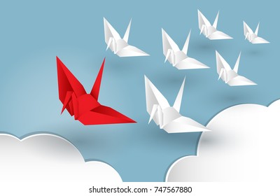 Vector illustration of leadership concept with origami red paper bird leading among white.