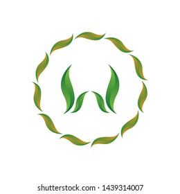 vector illustration letter w with leaf and circle nature icon logo design green color