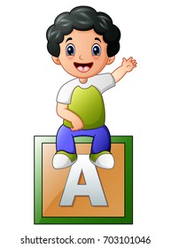 Vector illustration of Little boy sitting on alphabet cube