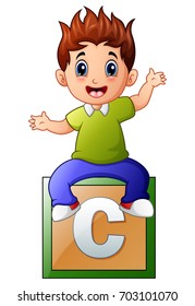 Vector illustration of Little boy sitting on alphabet cube