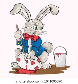 vector illustration of a little Easter Bunny in a costume coloring a tassel egg for a Catholic Easter holiday