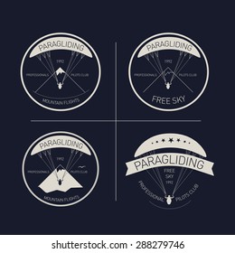 Vector illustration. Logos set paragliding club, professional pilots, mountain flights, free sky.