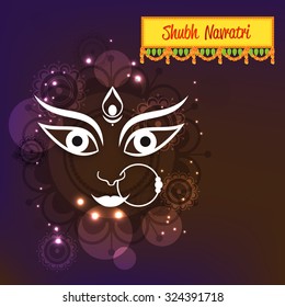Vector illustration of Maa Durga in a colourful background for Happy Navratri.