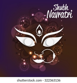 Vector illustration of Maa Durga in a golden background for Happy Navratri.