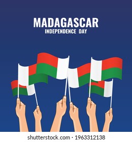 Vector Illustration of Madagascar Independence Day.   Hands hold the flags of the country
