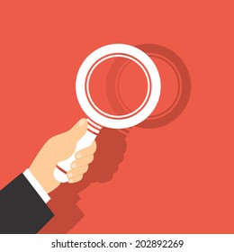 Vector Illustration Of  A Magnifying Glass in Hand 