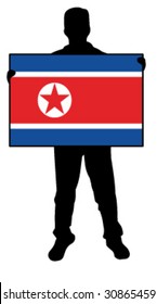 vector illustration of a  man holding a flag of north korea