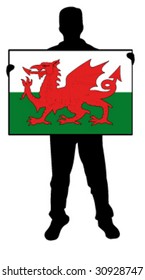 vector illustration of a  man holding a flag of wales