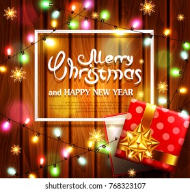 Vector illustration for Merry Christmas and Happy New Year.Greeting card with New Year's with bright luminous garlands on a wooden background and text in a frame.Template for elegant design of card