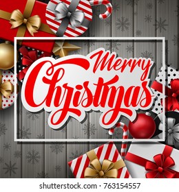 Vector illustration of Merry christmas text on paper label with christmas elements over gray wooden background