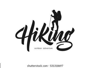 Vector illustration: Modern brush lettering of Hiking with silhouette of climber.