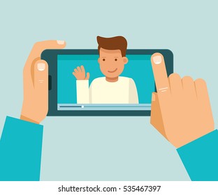 Vector illustration in modern flat style - video blogger concept - hand holding mobile phone with video player on the screen - male vlogger broadcasting on his personal channel