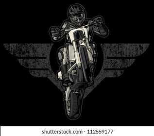 Vector illustration of a motocross racer doing a wheelie while riding in front of a pair of bold wings distressed with a grunge and paint splatter texture mix.