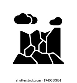 vector illustration of mountains icon. Simple mountains with clouds in the sky with glyph design style