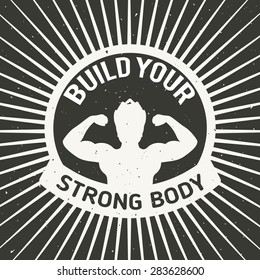 Vector illustration. Muscular man silhouette with black background and text - build your strong body. Inspirational and motivational poster