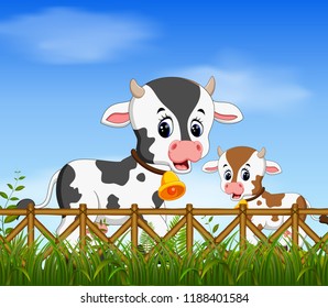vector illustration of the natural view with the cow and her little cow playing together with the happy face