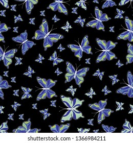 Vector illustration. Neutral, blue and black butterflies pattern. Decor background for clothing design. Cute butterfly seamless pattern for print textures.