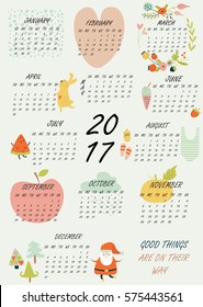 Vector illustration of new 2017 year calendar with cute hand drawn animals, fruits, vegetables, flowers and other illustrations in cartoon style