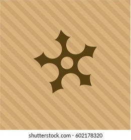 Vector illustration of ninja star icon vector in brown.
