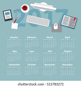 Vector illustration of an office table with notepad, computer, coffee cup, pencils and books in flat style. Space for work and study. View from above. Calendar of 2017 year, week starts from Sunday.