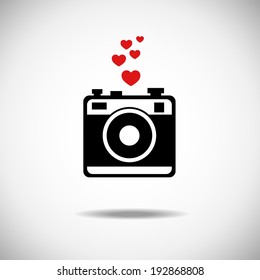 Vector illustration of an old camera with flash and hearts