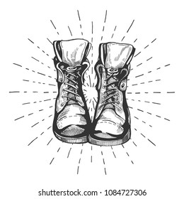 Vector illustration of an old leather laced travelling hiking boots with the sunburst. Vintage hand drawn style. 