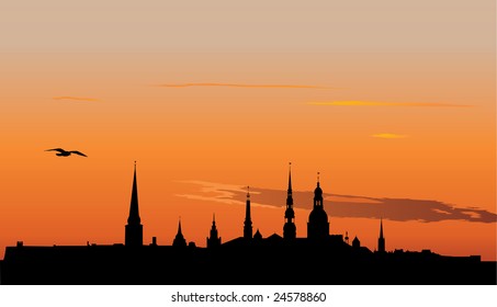 Vector illustration of Old Riga panorama silhouette in sunrise