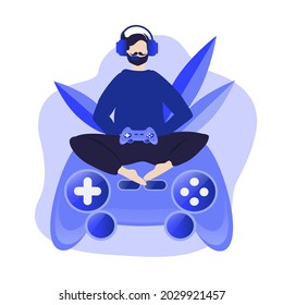 vector illustration on the theme of computer games, play station. male character in headphones plays while sitting on a huge gamepad. trend illustration in flat style