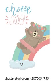 Vector illustration on a white background cartoon cute bear girl riding a rainbow and lettering Choose Joy. Teddy bear illustration is suitable for baby textiles, t-shirts, clothes, room decor.