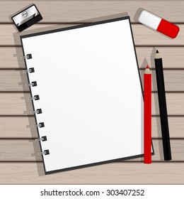 Vector illustration of an open notepad with ring holder, red and black pencils, eraser and sharpener on a table with wooden texture.