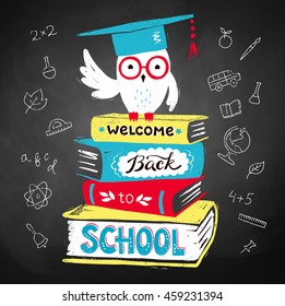 Vector illustration of owl wearing mortarboard sitting on books with Welcome Back to School lettering on black chalkboard background.