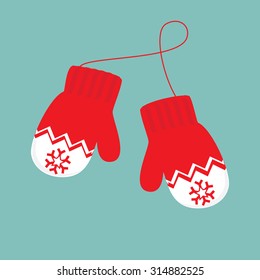 Vector illustration pair of knitted christmas mittens on blue background. Mitten icon. Christmas greeting card with mittens