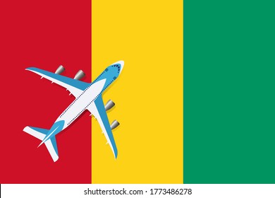 Vector Illustration of a passenger plane flying over the flag of Guinea. Concept of tourism and travel