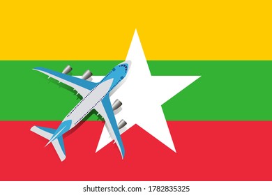Vector Illustration of a passenger plane flying over the flag of Myanmar. Concept of tourism and travel