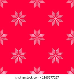 Vector illustration pattern with red background and white cross stitched snowflake