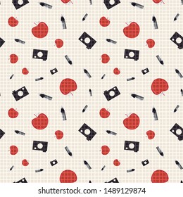 Vector illustration of pencils, cameras, red apples and eraser symbols on white grid background. Seamless pattern for back to school supplies, textile, gifts, wallpaper and scrapbooking.