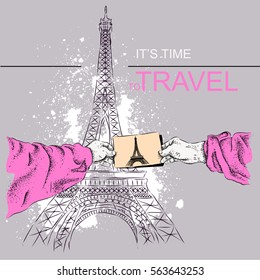 Vector illustration a photo frame in hands of the person. The person holds photo of Eiffel Tower in hand.