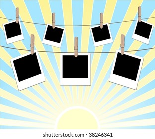 vector illustration of photo frames on the rope with the clothes peg on sunny background