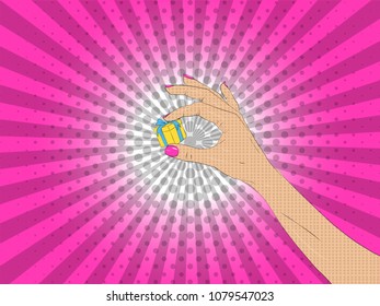 Vector illustration of pop art style. Vector colorful background in pop art retro comic style. A feminine hand that holds a small gift
