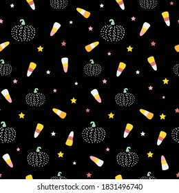 Vector illustration of repeat pattern with fun halloween candy and pumpkins on a black background.