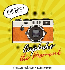 Vector illustration of a retro photo camera in a pop art style. Vintage photo camera icon. Capture the moment text.