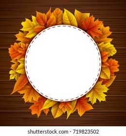 Vector illustration of Round frame with autumn leaves on wooden background